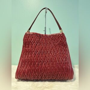 Authentic Coach large shoulder bag in red wine color. 3 compartment.pre-owned